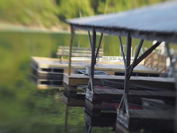 This is an image I took last year with the tilt-shift lens at a local lake. The tilt lets me focus on a small portion of the image and lets the rest blur. It takes a boring angled shot of a dock and makes it pretty interesting to investigate visually. 